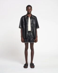 Nanushka Amil - Raffia-Trimmed Okobor™ Alt-Leather Shorts - Black 9 Nanushka Amil - Raffia-Trimmed Okobor™ Alt-Leather Shorts - Black -Nanushka Wear Shop NAN SS24 ECOMM MW FULL BODY CROPPED 23 6e2cffc0 ab7a 4424 b41b 73294a982d47