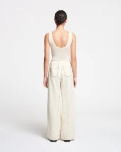 Nanushka Evea - Glass Poplin Pants - Oat 12 Nanushka Evea - Glass Poplin Pants - Oat -Nanushka Wear Shop NAN SS24 ECOMM WW FULL BODY CROPPED 126
