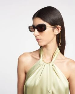 Nanushka Aliza Charm - Bio-Plastic Oval Sunglasses - Off Black -Nanushka Wear Shop NAN SS24 ECOMM WW FULL BODY CROPPED 81